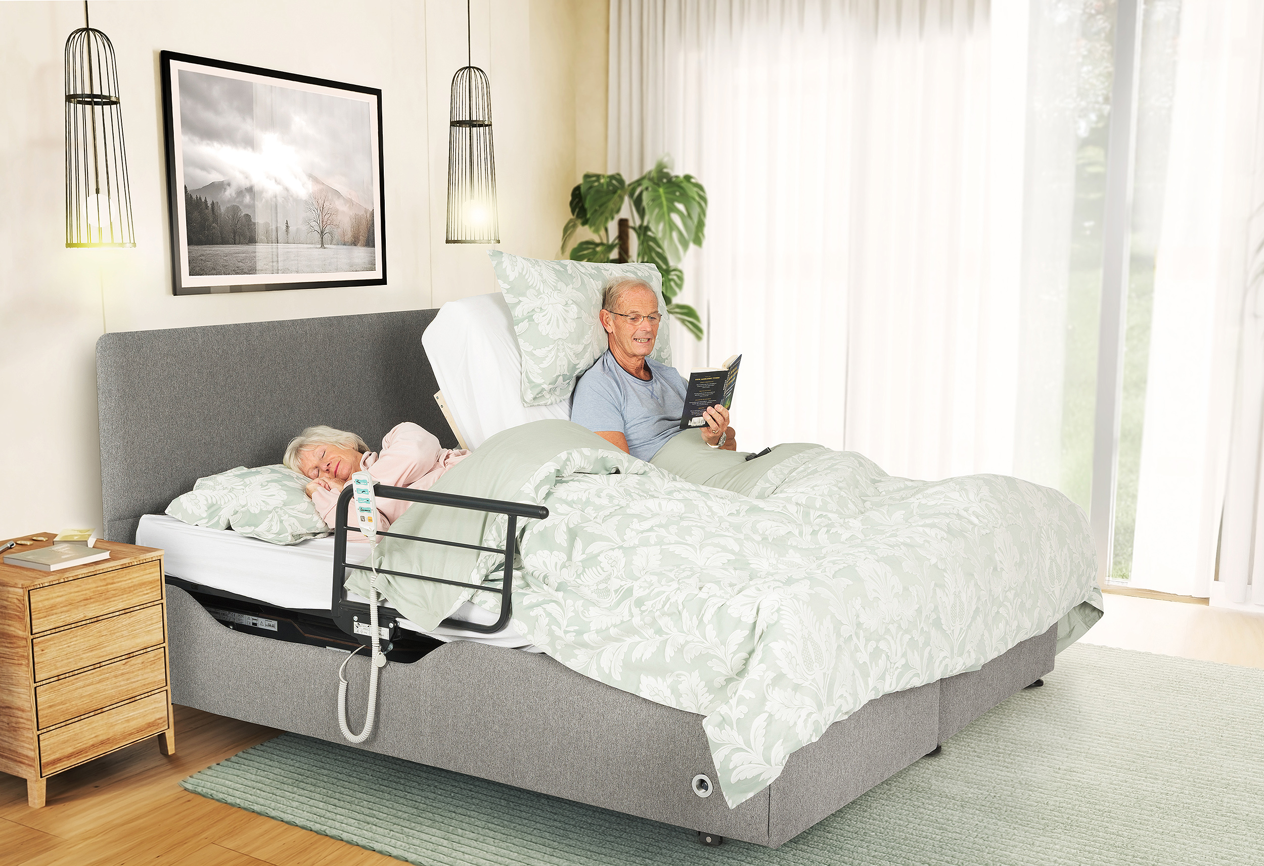 Couple in a dual controlled double combination divan style adjustable bed
