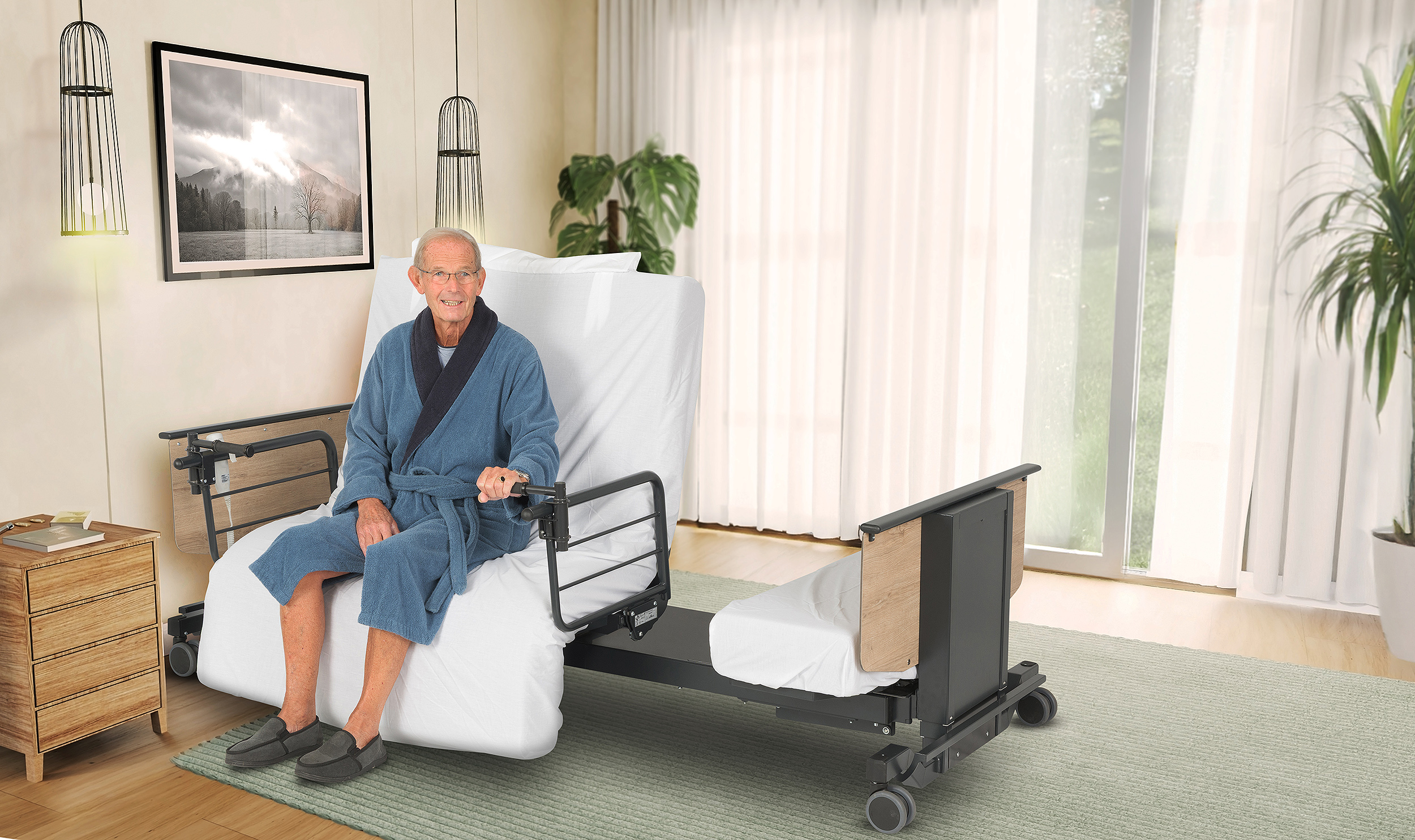Man sat on an Orbit plus size heavy duty rotating adjustable bed in a bedroom