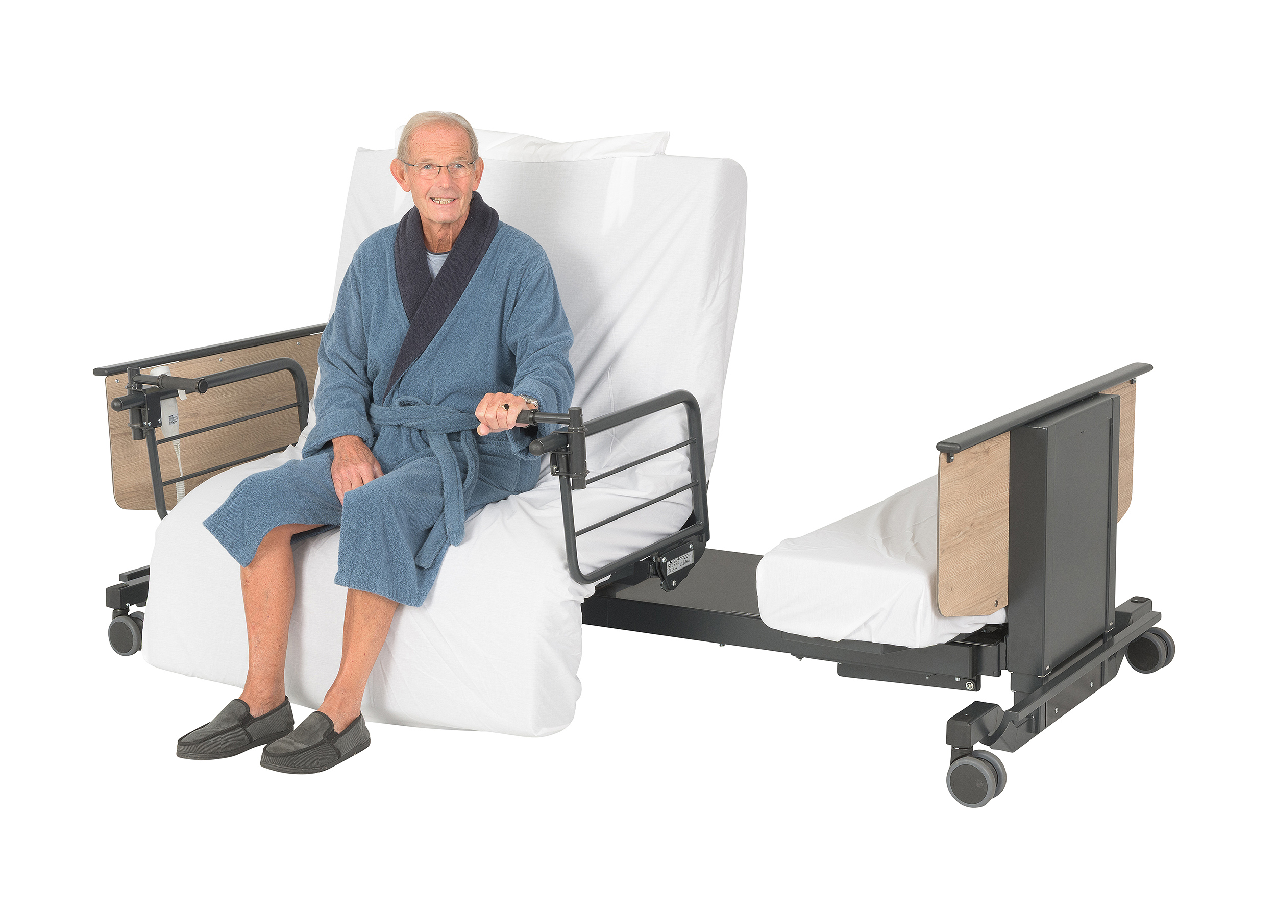 Man sat on an Orbit plus size heavy duty rotating adjustable bed