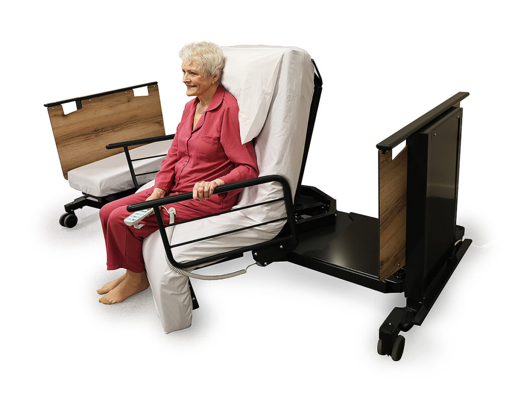 Woman using a heavy duty rotating adjustable bed