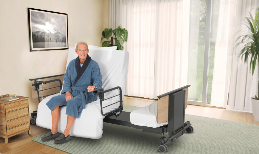 Man in pyjamas sitting on Orbit 235 bed