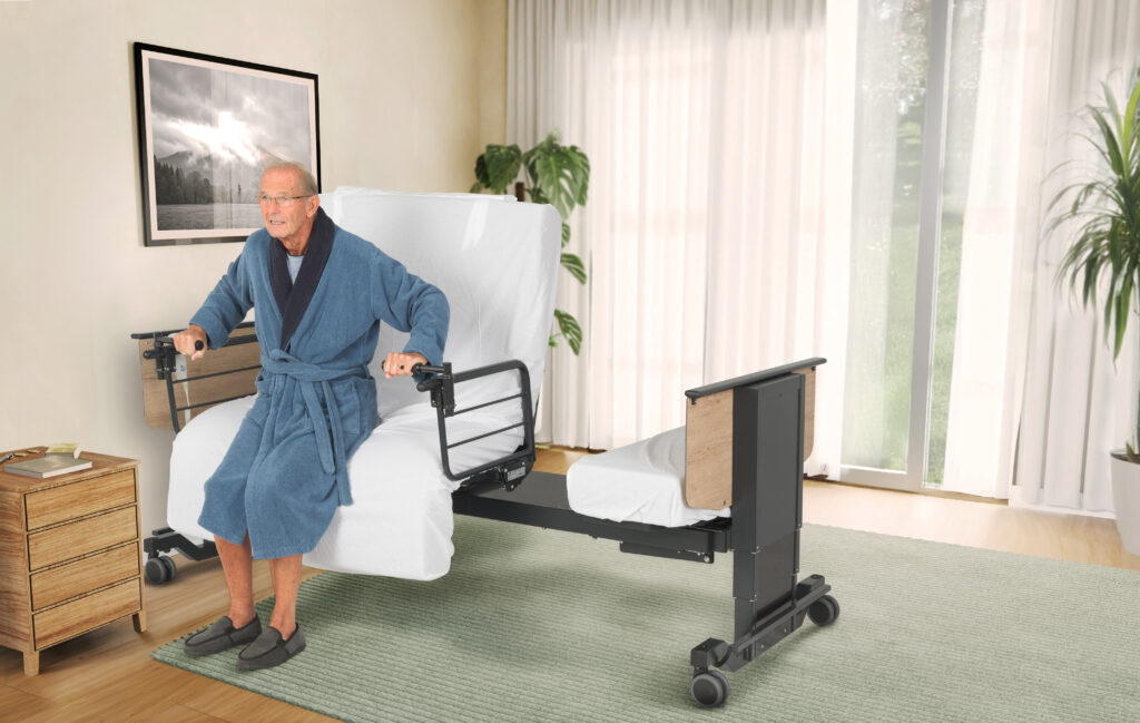 Man sitting upright on a rotating adjustable bed with the mattress